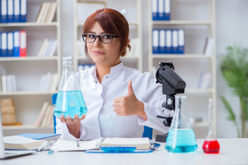 Female scientist researcher conducting an experiment in a labora