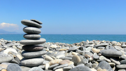 Meditation in the Mediterranean coast - flat pebbles on each other