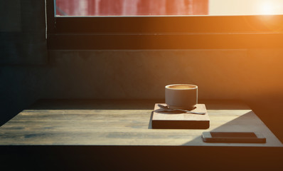 Coffee cup in coffee shop - vintage style effect picture