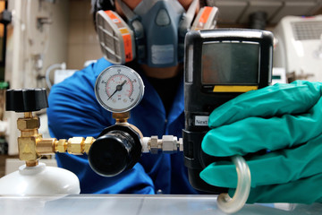 Instrument technician is take standard gas for the job calibrate or function check of personal gas tester or gas detector.