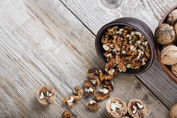 chopped walnuts on a wooden background