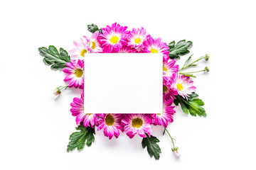 Floral mockup. Sheet of paper in frame of pink flowers on white background top view