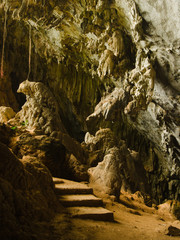 Fototapeta na wymiar Man-made steps and natural formations in Yateak Pyan Cave, Hpa-An, Myanmar