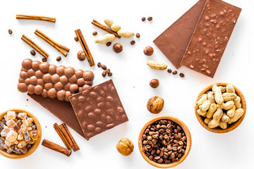 Ingredients for chocolates on white background top view