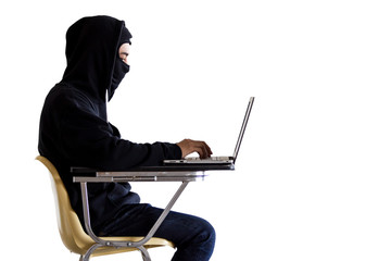Hacker in black suit is hacking laptop computer isolated object on pure white background.