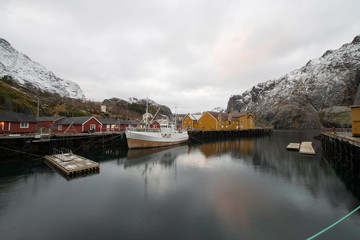 Little port of a fisherman`s village in the fjiord