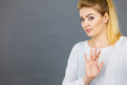 Woman deny something showing stop gesture with hands