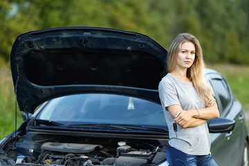 Young traveller woman standing outside car