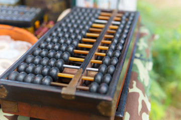 close up of wood abacus. chinese vintage calculator use for calculation in business or finance and...