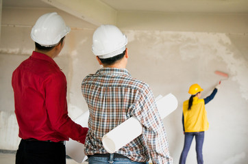 Engineers inspect building work at site