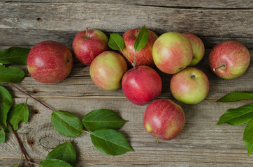 Apples on old wooden background