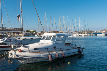 Fototapeta premium Boats and yachts moored in marina of Naxos town (Chora). Cyclades Islands, Greece.