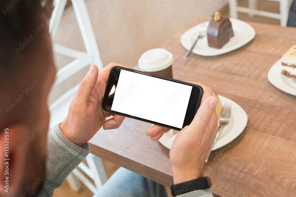 Aufkleber watching movie or read news on smart phone in horizontal position with isolated screen for mockup.