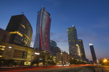 Fototapeta na wymiar Warsaw, Poland-December 2016:skyscrapers by night road