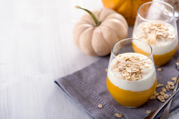 Pumpkin smoothie with oats for healthy breakfast copy space background