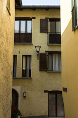 Fototapeta na wymiar vintage yellow paintet house street scene mediterranean architecture design
