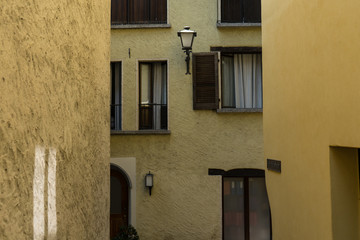Fototapeta na wymiar vintage yellow paintet house street scene mediterranean architecture design