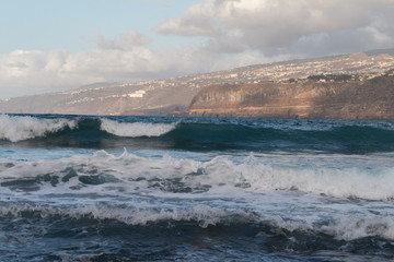 Ocean waves seen from the beach in Puerto de la Cruz in Tenerife