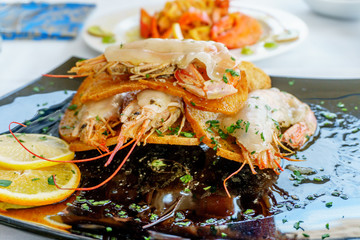 a dish of grilled shrimps with spice