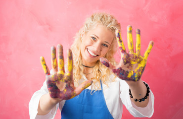 Female artist with paint on her hands