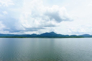 panorama view of big lagoon with blue sky and cloud and mountain background. maemoh, thailand