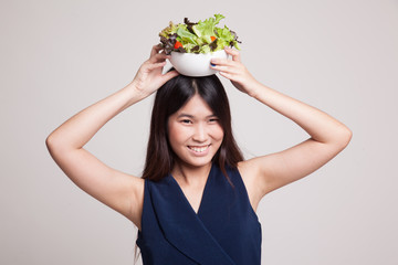 Healthy Asian woman with salad.