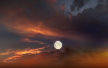 Full moon background  . Red sunset and moon . Glowing sunset and full moon  . Dramatic nature...