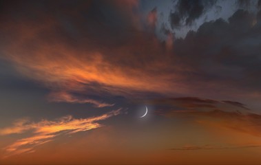  Red sunset and moon . Dramatic nature background . Religion background . The moon against the background   