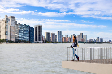 Female tourist admiring Chicago cityscape