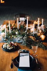 decorated table with flowers and candles in the loft style room