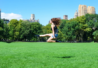 Girl jumping in Central park, New York