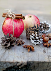 Fototapeta na wymiar dessert, apple with cinnamon and nuts, Christmas decor and food on a wooden table