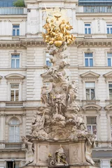 Zelfklevend Fotobehang Vienna, Plague Column or Holy Trinity column located on the Graben, a street in the inner city of Vienna, Austria. © lenaivanova2311