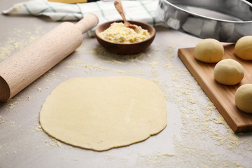 Rolled dough for tortillas on kitchen table