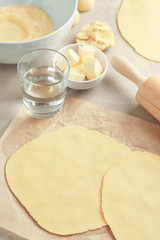Rolled dough for tortillas on kitchen table