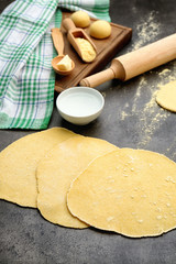 Rolled dough for tortillas on kitchen table