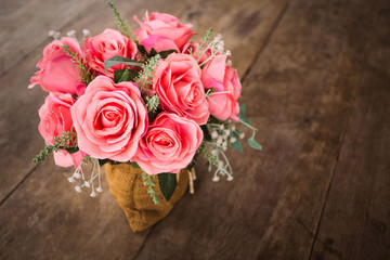 Pink roses in decorative vases