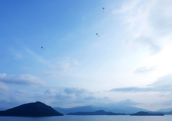 Fototapeta na wymiar mountain, lake, kite, blue sky and cloud
