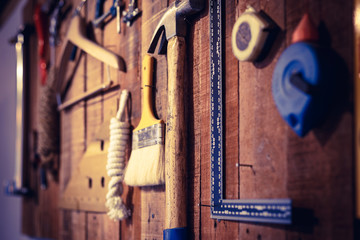 Hand tools are stored on the wall.