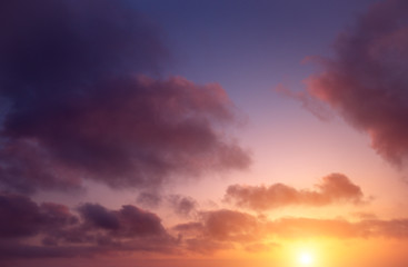 Fototapeta na wymiar Bright sunset in the sky and clouds.