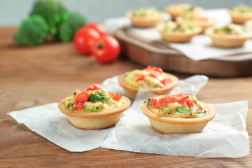 Broccoli quiche tartlets on table