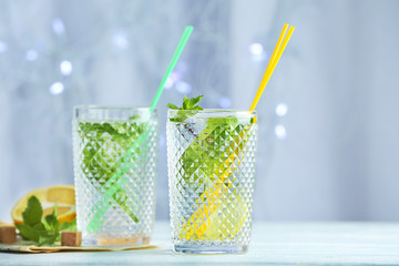 Two glasses with mint julep on table