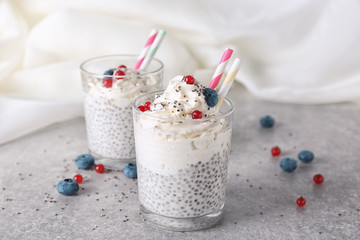 Smoothies with chia seeds in glasses on table