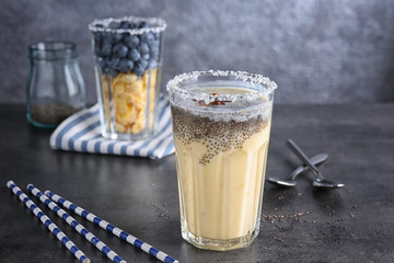 Smoothie with chia seeds in glass on table