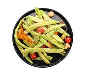 Black plate with delicious green beans, mushrooms and cherry tomatoes on white background