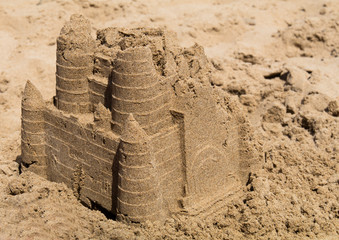 Sand castle part collapsed on beach