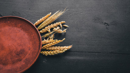 Clay pot. Dishes. On a wooden background. Top view. Free space.