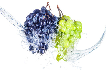 Blue and green grape with water splash isolated white