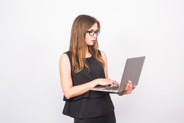 Fototapeta premium business, technology and people concept - businesswoman with laptop on white background