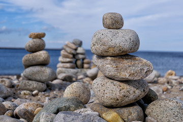 Fototapeta na wymiar Stacked Stones on a Quiet Beach